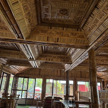 Carved bamboo dining hall at Hira Moti Restaurant